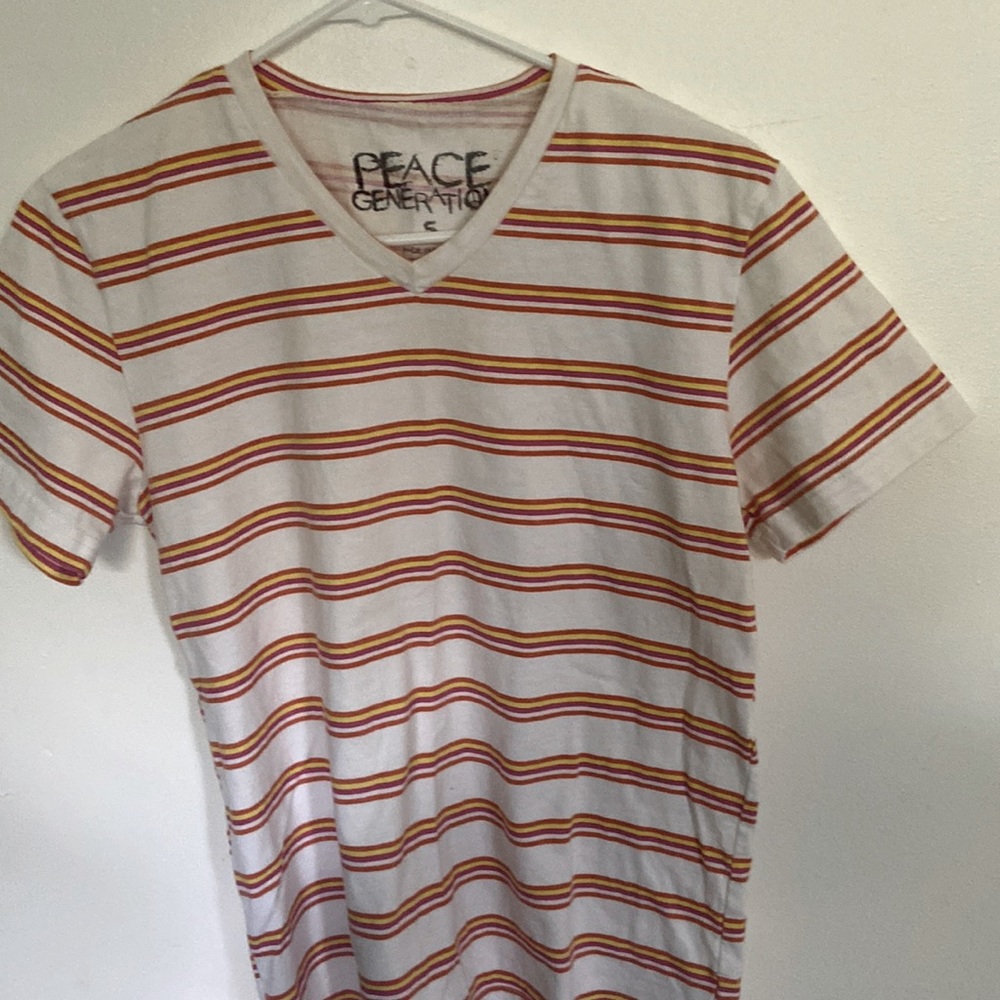 Peace Generation tee shirt, striped in white, yellow, pink and gold.